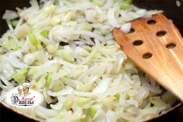 Cut celery and onions on a frying pan